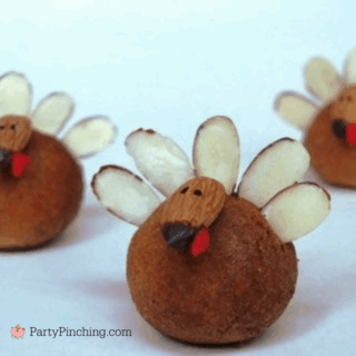 Turkey donut holes for Thanksgiving no bake dessert treat turkey donuts with almond head and feathers easy to make cute place setting table decorations