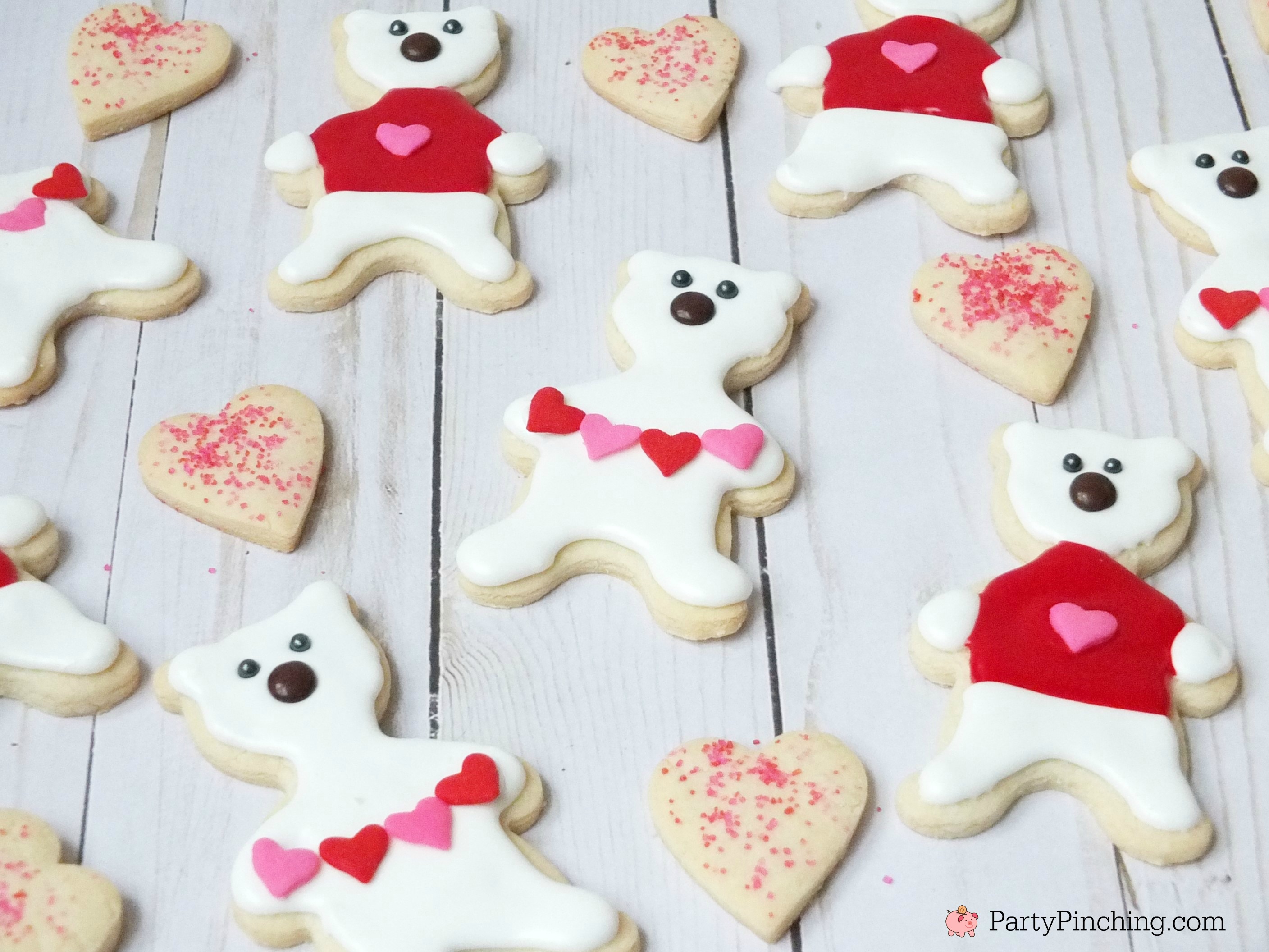 Polar bear cookies, Valentine's Day polar bear cookies, cute cookie ideas for Valentine's Day, polar bear sweater cookie, polar bear heart garland cookie, fun food for kids, cute food ideas, sweet treats