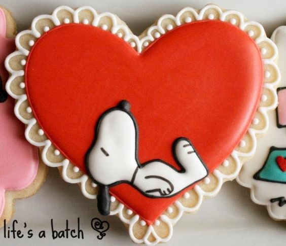 Snoopy Valentine's Day cookie, Peanuts cookies, cute Valentine's day heart cookie, cartoon Valentine cookie, adorable heart cookie with lace, sweet treats, fun food for kids, holiday cookie ideas