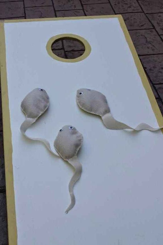 sperm cornhole game, baby shower ideas, cute baby shower, best baby shower ideas, baby shower cake, fun games for baby shower, baby shower food