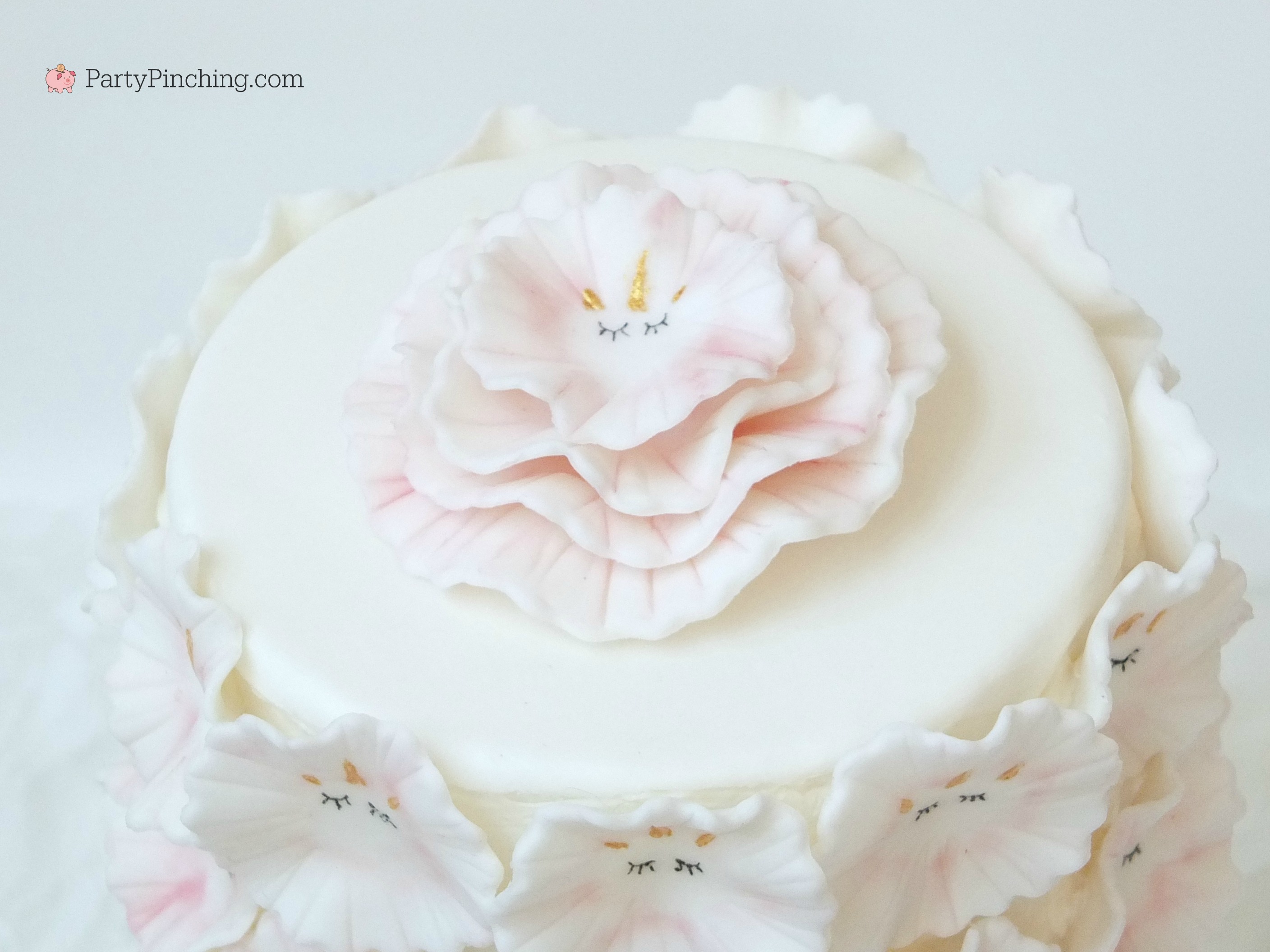 fondant unicorn cake, ruffle unicorn cake, flower unicorn cake, pretty unicorn cake, beautiful gorgeous unicorn cake, pink and white unicorn cake, fluffy flower petal unicorn cake pink white