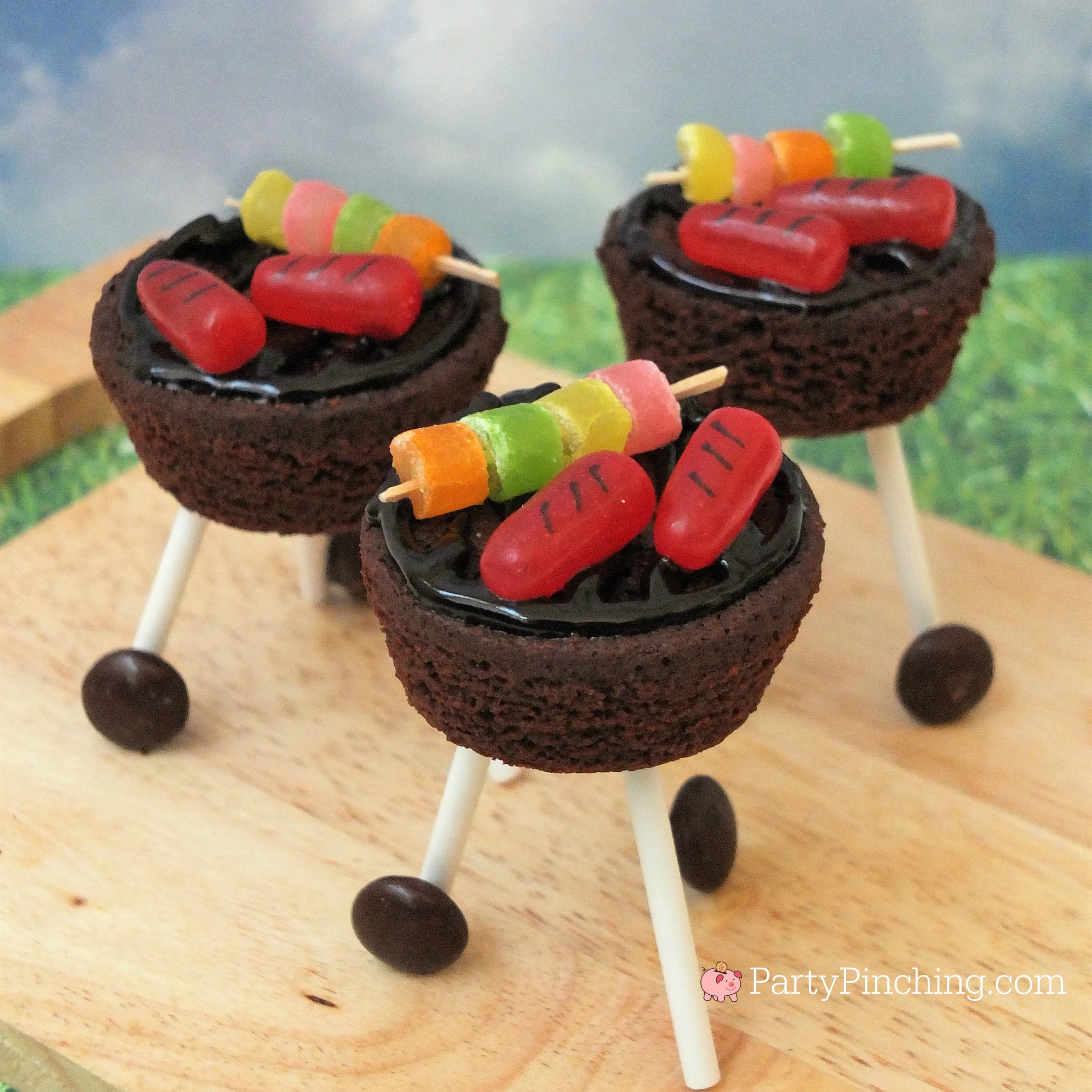 brownie outdoor grill, brownie grill bites, BBQ brownie grill with candy hot dog and skewers, candy skewer, candy grilled hot dogs, charcoal grill dessert brownies, sweet treat picnic BBQ brownies with wheels, kettle BBQ brownies