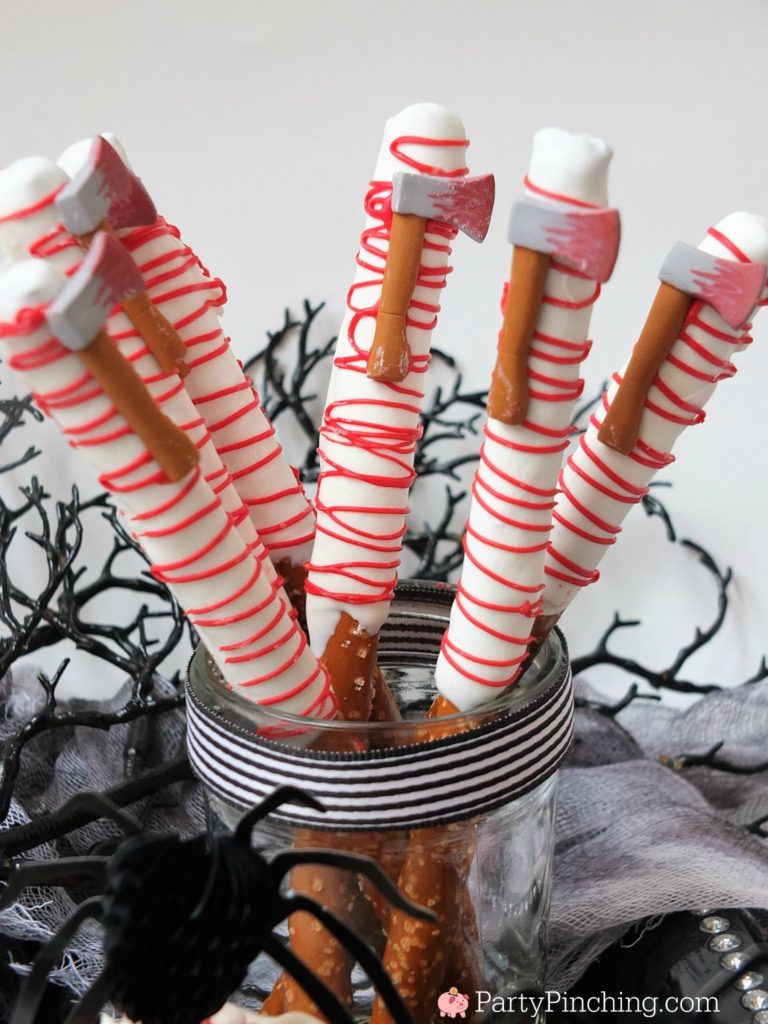 Spooky Halloween treats, creepy gross bloody dessert treats, hatchet pretzels with blood icing, spider blood cupcakes, bloody brain Oreos with candy hatchet axe