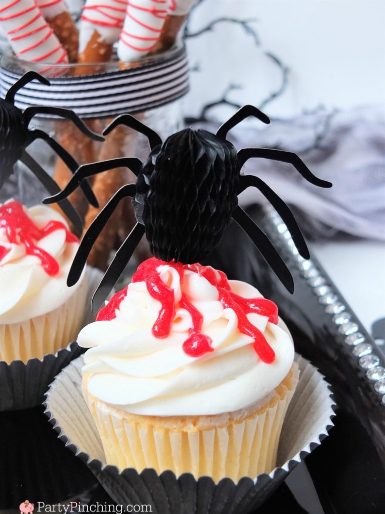 Spooky Halloween treats, creepy gross bloody dessert treats, hatchet pretzels with blood icing, spider blood cupcakes, bloody brain Oreos with candy hatchet axe