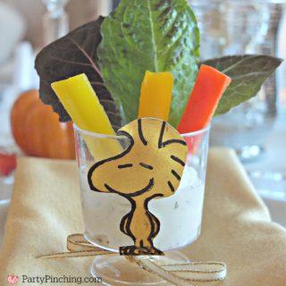 Charlie Brown Thanksgiving, Snoopy Thanksgiving, Woodstock salad appetizer Thanksgivivng table, Peanuts theme Thanksgiving dinner snack dessert ideas for kids adults, Snoopy popcorn jelly bean toast pretzel snack dinner Thanksgiving, Woodstock salad