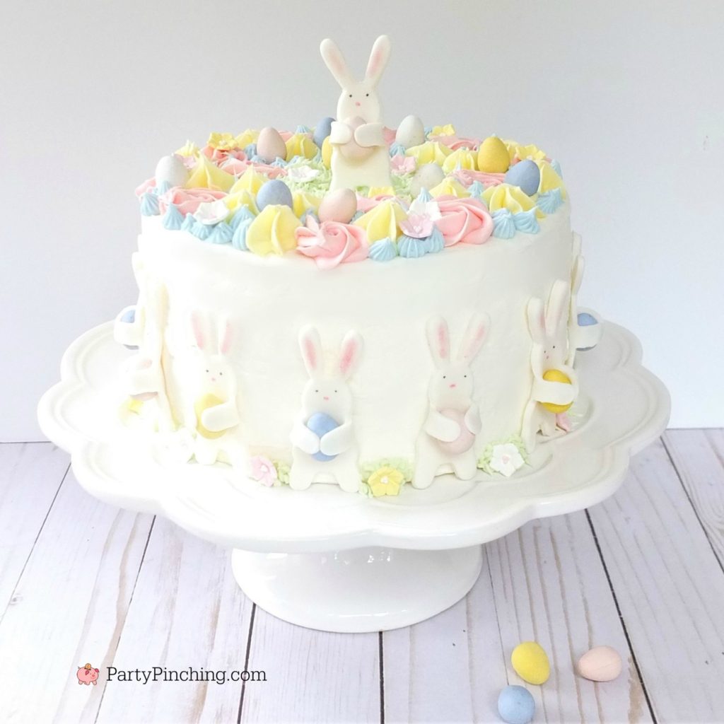 Easter Bunny Egg Hunt Cake, cute pastel Easter Cake, beautiful adorable pretty Easter cake, fondant bunny cake, Bunnies holding eggs, pastel Spring flower cake, Best Easter cake recipe
