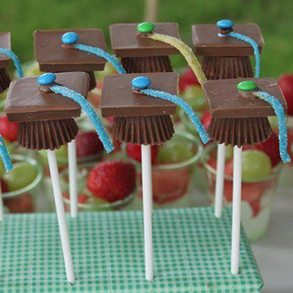 grad cap candy pops, Graduation Marquee Cake, Best Graduation Party Food Ideas, food grad guests will love, fun easy graduate party food buffets, grad food drink bars, best graduation cakes cupcakes desserts cookies, fun graduation open house food, inexpensive cheap grad party ideas for teens, partypinching.com
