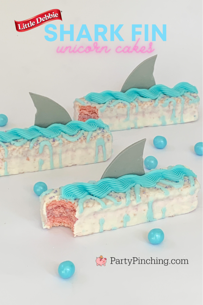 Shark fin cakes, Shark-cuterie Board, best charcuterie board ideas for kids, best charcuterie board, cute charcuterie boards, best fruit trays, summer charcuterie, best summer charcuterie, shark week, shark fruit board, shark food, best shark party ideas, Little Debbie summer, Party Pinching, shark week food, shark week
