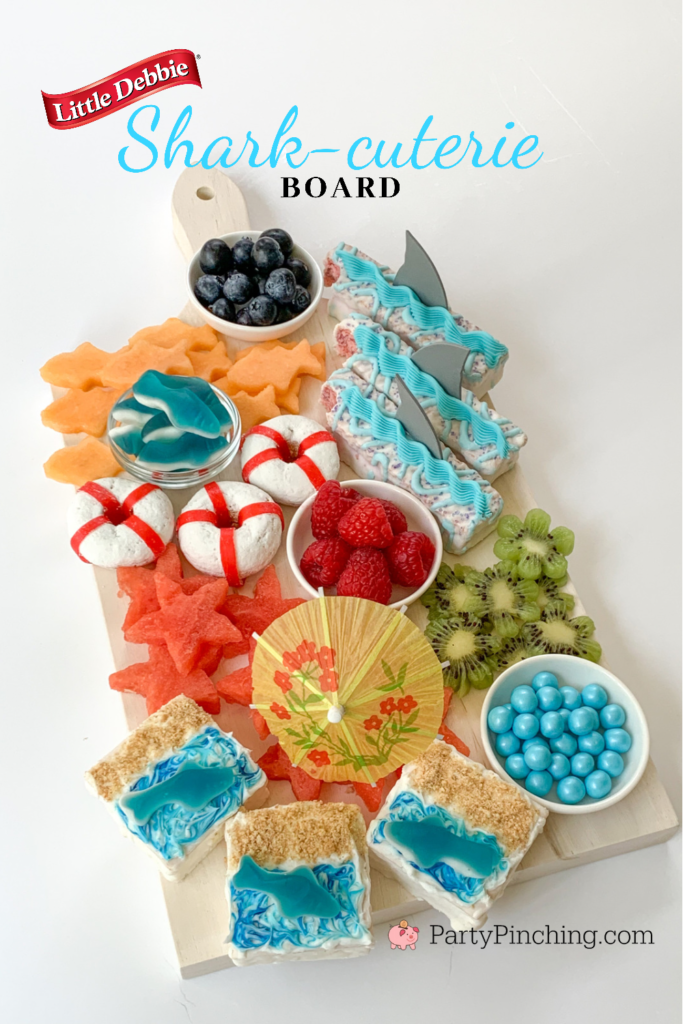 Shark-cuterie Board, best charcuterie board ideas for kids, best charcuterie board, cute charcuterie boards, best fruit trays, summer charcuterie, best summer charcuterie, shark week, shark fruit board, shark food, best shark party ideas, Little Debbie summer, Party Pinching, shark week food, shark week
