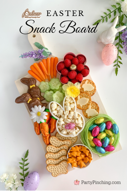 Easter snack board, Easter charcuterie board, Easter candy board, best charcuterie board ideas, best Easter charcuterie board, chocolate bunny charcuterie board, healthy charcuterie board for kids, cookie cutter charcuterie board, Easter candy charcuterie board, bunny cheese crackers, chocolate carrots, butterfly crackers, bunny cheese , foil covered eggs, R.M. Palmer