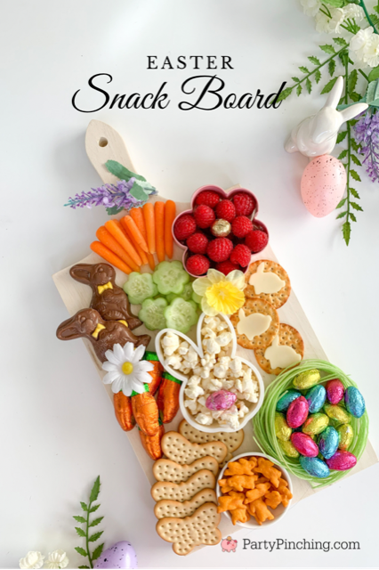 Easter snack board, Easter charcuterie board, Easter candy board, best charcuterie board ideas, best Easter charcuterie board, chocolate bunny charcuterie board, healthy charcuterie board for kids, cookie cutter charcuterie board, Easter candy charcuterie board, bunny cheese crackers, chocolate carrots, butterfly crackers, bunny cheese , foil covered eggs, R.M. Palmer