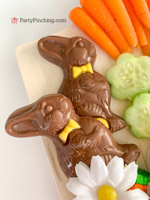 Easter snack board, Easter charcuterie board, Easter candy board, best charcuterie board ideas, best Easter charcuterie board, chocolate bunny charcuterie board, healthy charcuterie board for kids, cookie cutter charcuterie board, Easter candy charcuterie board, bunny cheese crackers, chocolate carrots, butterfly crackers, bunny cheese , foil covered eggs, R.M. Palmer