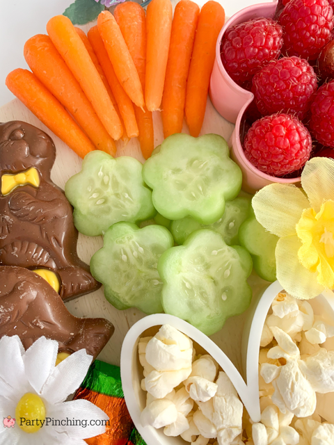 Easter snack board, Easter charcuterie board, Easter candy board, best charcuterie board ideas, best Easter charcuterie board, chocolate bunny charcuterie board, healthy charcuterie board for kids, cookie cutter charcuterie board, Easter candy charcuterie board, bunny cheese crackers, chocolate carrots, butterfly crackers, bunny cheese , foil covered eggs, R.M. Palmer