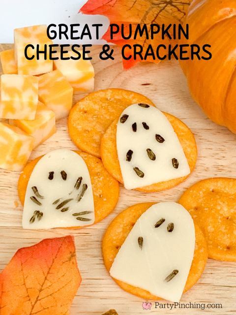 charlie brown great pumpkin cheese ghosts, provolone cheese for charcuterie board, black edible marker halloween charcuterie snack grazing board.