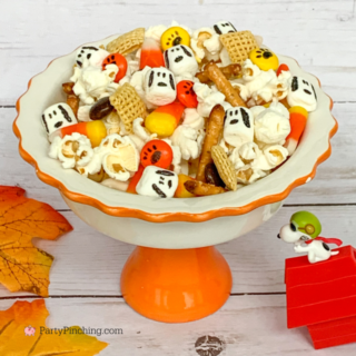snoopy snack mix, snoopy halloween great pumpkin snack mix, chex mix for kids, popcorn snoopy marshmallows pretzels candy corn M&M's, easy snack mix for great pumpkin charlie brown movie, snoopy linus lucy charlie brown peanuts gang party food