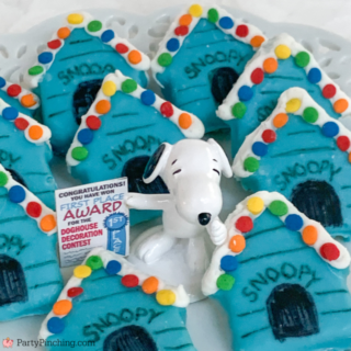snoopy's doghouse christmas cakes, a charlie brown christmas movie theme party food, cute snoopy's blue doghouse christmas lights, sara lee frozen pound cake snoopy cake, snoopy, charlie brown, snoopy dessert cake, best easy snoopy charlie brown food dessert party ideas