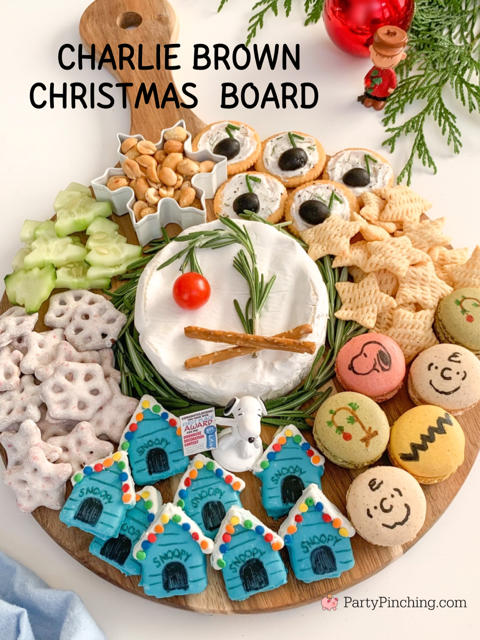 charlie brown Christmas charcuterie board, charlie brown snoopy christmas grazing snack board, best charlie brown christmas party food dessert snack movie ideas, charlie brown snoopy macarons, snoopy christmas doghouse blue cakes, schroder music note olive dip appetizers, peanuts gang charcuterie board ideas, brie charlie brown christmas tree rosemary tomato, cucumber christmas trees, charcuterie board for kids