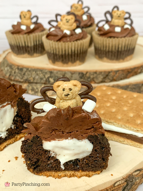 Beary cute s'mores cupcakes, s'mores cupcakes, cute teddy graham smore's cupcakes, marshmallow filled s'mores cupcakes, graham cracker crust s'mores cupcakes, s'mores cupcakes with marshmallow and graham crackers, best chocolate frosting recipe ever, easy homemade chocolate frosting, marshmallow fluff filling, best ever smores cupcake recipe with mini mallow bits marshmallow topping