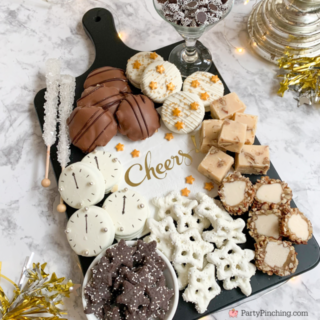New Year's Eve Dessert Board, New Year's Eve charcuterie board, New Year's eve snack board, best easy New Year's eve recipes food party ideas, clock cookies, best charcuterie board ideas, Trader Joe's star cookies,