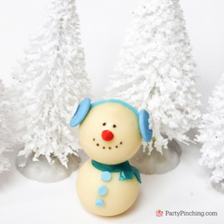 Lindt White Chocolate Truffle Snowman, cute white chocolate snowman truffle, adorable snowman truffle white chocolate candy cupcake cake topper, white chocolate snowman with earmuffs and scarf, easy kid friendly white chocolate snowman, best easy Christmas candy recipe for kids no bake
