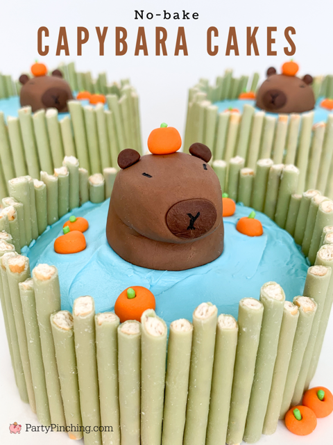 capybara mini cakes, capybara cakes, cute capybara cupcakes, capybara moon pies, adorable capybara cake, fondant capybara, step by step tutorial capybara cake recipe, best capybara cake, capybara with orange on head fondant cupcake cake topper, easy best capybara fondant cake, pocky cake,  no bake capybara cake, capybara cupcake toppers