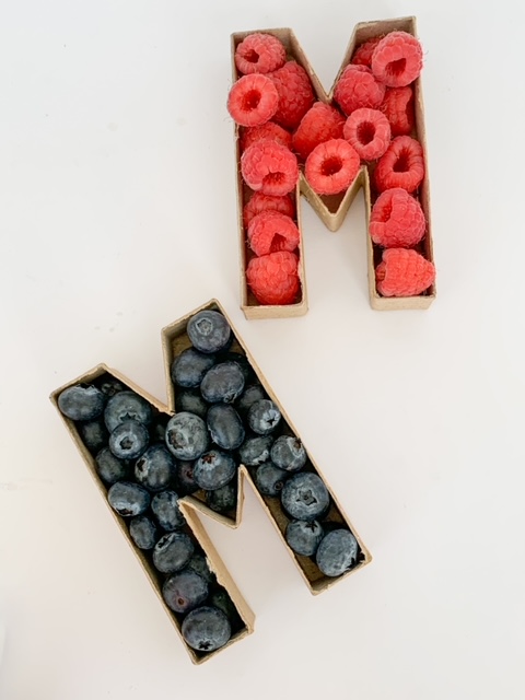 paper mache letters filled with fruit