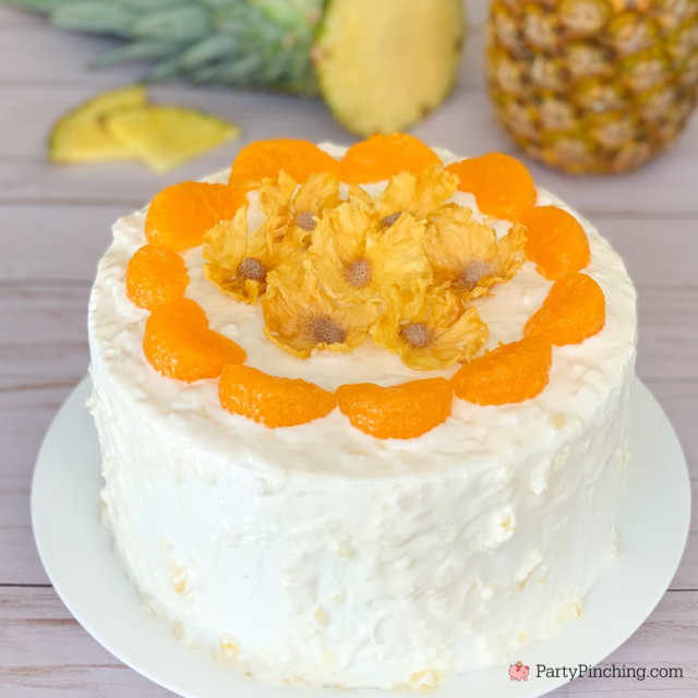 best ever pig pickin' cake with dried pineapple flowers, best sunshine cake, best easy pig picking cake recipe, best easy mandrin orange pineapple cake recipe ever, best southern pig pickin' cake recipe, pretty pig' picking cake recipe southern summer cake for a crowd, pineapple whipped cream frosting cool whip vanilla pudding