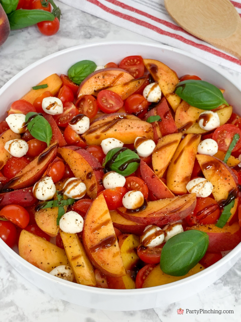 the best peach caprese summer salad, fresh peach salad, summer caprese salad, peach salad, easy best summer salad recipes, fast easy salad, fresh peaches cherry tomatos fresh basil mozzerella pearls summer salad, best picnic potluck salad ideas for a crowd, balsamic glaze