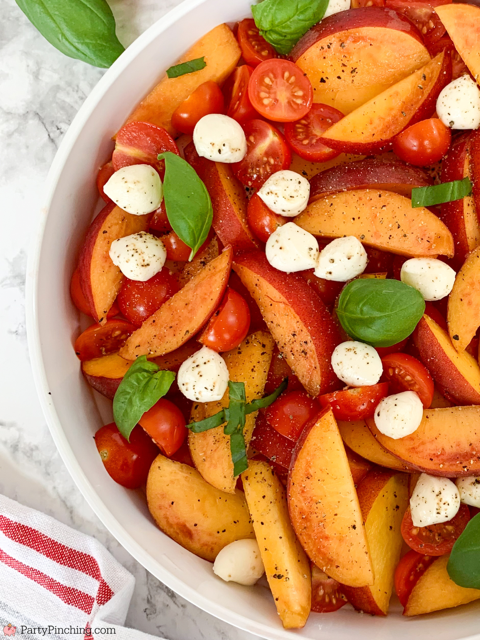 the best peach caprese summer salad, fresh peach salad, summer caprese salad, peach salad, easy best summer salad recipes, fast easy salad, fresh peaches cherry tomatos fresh basil mozzerella pearls summer salad, best picnic potluck salad ideas for a crowd,