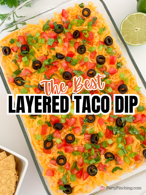 The best layered taco dip, easy best taco dip recipe, hot or cold taco dip recipe, easy appetizer dip for big game superbowl, best picnic potluck ideas for a crowd easy family friendly budget meals, beans guacamole sour cream taco seasoning tomato onion cheese olives lime taco dip