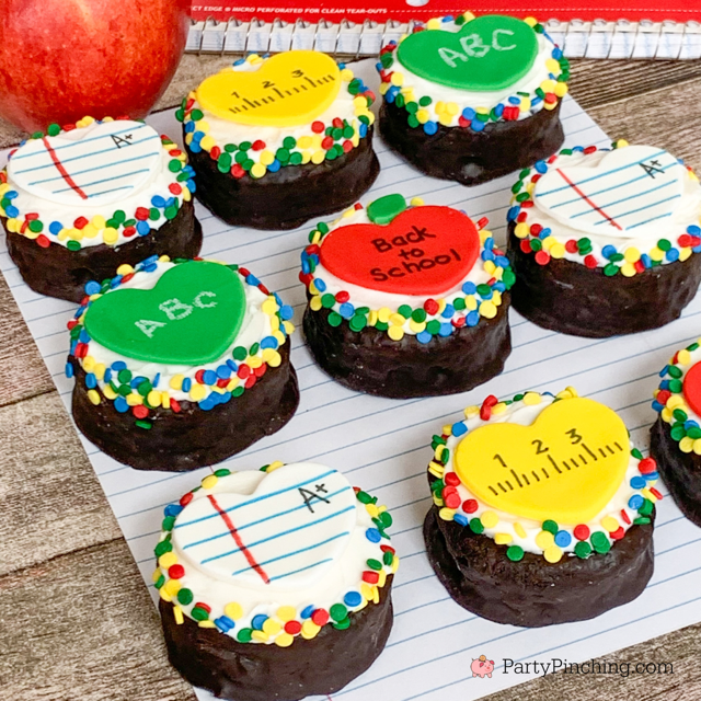 back to school ring dings, decorated ring dings snack cakes drakes cakes, apple notebook paper ruler chalkboard fondant hearts for school cupcakes, decorated snack cakes for teachers
