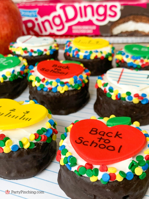 back to school ring dings, decorated ring dings snack cakes drakes cakes, apple notebook paper ruler chalkboard fondant hearts for school cupcakes, decorated snack cakes for teachers
