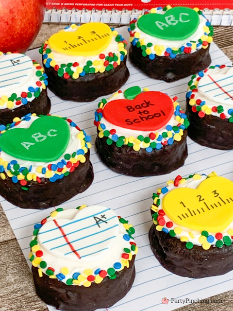 back to school ring dings, decorated ring dings snack cakes drakes cakes, apple notebook paper ruler chalkboard fondant hearts for school cupcakes, decorated snack cakes for teachers