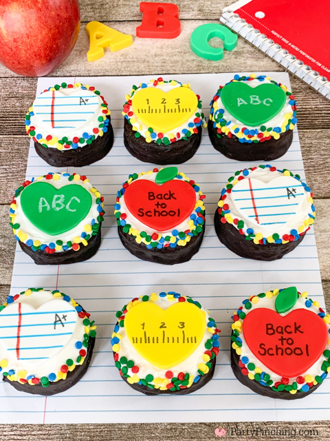 back to school ring dings, decorated ring dings snack cakes drakes cakes, apple notebook paper ruler chalkboard fondant hearts for school cupcakes, decorated snack cakes for teachers