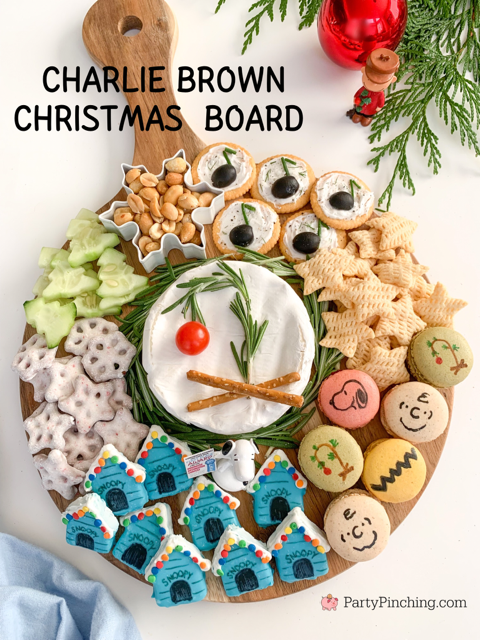 charlie brown Christmas charcuterie board, charlie brown snoopy christmas grazing snack board, best charlie brown christmas party food dessert snack movie ideas, charlie brown snoopy macarons, snoopy christmas doghouse blue cakes, schroder music note olive dip appetizers, peanuts gang charcuterie board ideas, brie charlie brown christmas tree rosemary tomato, cucumber christmas trees, charcuterie board for kids