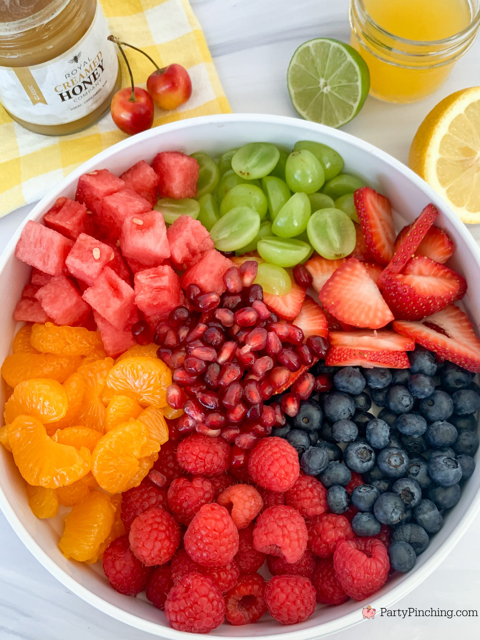 Summer Fruit Salad with Honey Citrus Dressing, easy best fruit salad recipe, quick easy fruit salad for a crowd picnics potlucks BBQ church sides, watermelon strawberry blueberry mandarin orange grapes pomegranate raspberry salad, best ever summer fruit salad refreshing pretty rainbow fruit salad