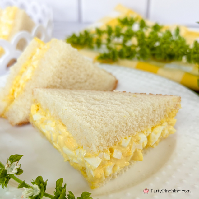 First boil the eggs for 20 minutes. Remove and put into bowl of ice water. Let cool completely. Next peel eggs and chop fine. Now add the mayonnaise, mustard, salt and pepper. Mix until thoroughly combined. Spread egg salad mixture on a piece of white bread. Top with another slice of bread. Cut the sandwich diagonally. Cut diagonally again for smaller sandwiches.