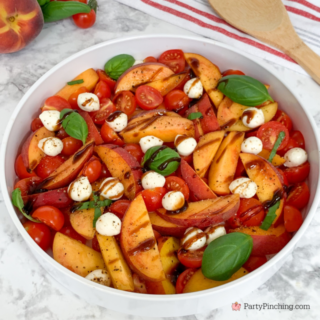 the best peach caprese summer salad, fresh peach salad, summer caprese salad, peach salad, easy best summer salad recipes, fast easy salad, fresh peaches cherry tomatos fresh basil mozzerella pearls summer salad, best picnic potluck salad ideas for a crowd,