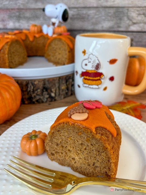 best easy Snoopy Pumpkin Spice Bundt Cake recie, Duncan Hines Snoopy The Great Pumpkin Bundt Cake and Glaze Mix, easy best fall cake, easy best pumpkin spice cake for fall, sweater weather Snoopy, Snoopy with a sweater, how to make Snoopy sweater with mini pumpkins and latte, fall decorated bundt cake with icing leaves and Trader Joe's chocolate pumpkins