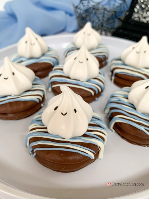 a baby is brewing baby shower Halloween theme for baby boy, cute Halloween baby shower ghost cookies, cute onesie cookies for baby shower, cute mummy cupcake cauldron brownies, cute bat cookies, cute ghost meringue cookies, spider oreos