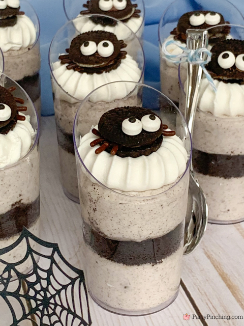 a baby is brewing baby shower Halloween theme for baby boy, cute Halloween baby shower ghost cookies, cute onesie cookies for baby shower, cute mummy cupcake cauldron brownies, cute bat cookies, cute ghost meringue cookies, spider oreos