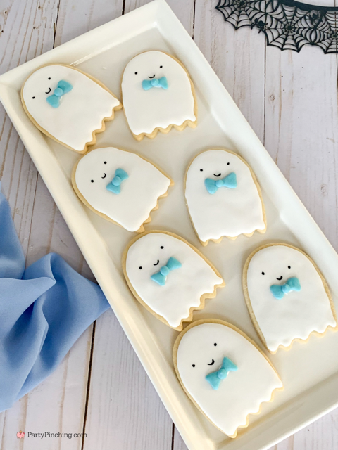 a baby is brewing baby shower Halloween theme for baby boy, cute Halloween baby shower ghost cookies, cute onesie cookies for baby shower, cute mummy cupcake cauldron brownies, cute bat cookies, cute ghost meringue cookies, spider oreos