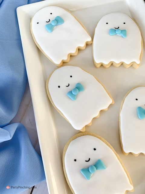 a baby is brewing baby shower Halloween theme for baby boy, cute Halloween baby shower ghost cookies, cute onesie cookies for baby shower, cute mummy cupcake cauldron brownies, cute bat cookies, cute ghost meringue cookies, spider oreos