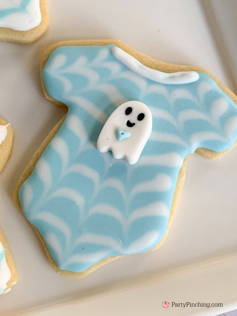a baby is brewing baby shower Halloween theme for baby boy, cute Halloween baby shower ghost cookies, cute onesie cookies for baby shower, cute mummy cupcake cauldron brownies, cute bat cookies, cute ghost meringue cookies, spider oreos