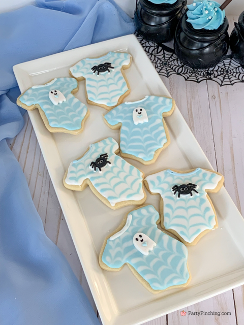 a baby is brewing baby shower Halloween theme for baby boy, cute Halloween baby shower ghost cookies, cute onesie cookies for baby shower, cute mummy cupcake cauldron brownies, cute bat cookies, cute ghost meringue cookies, spider oreos
