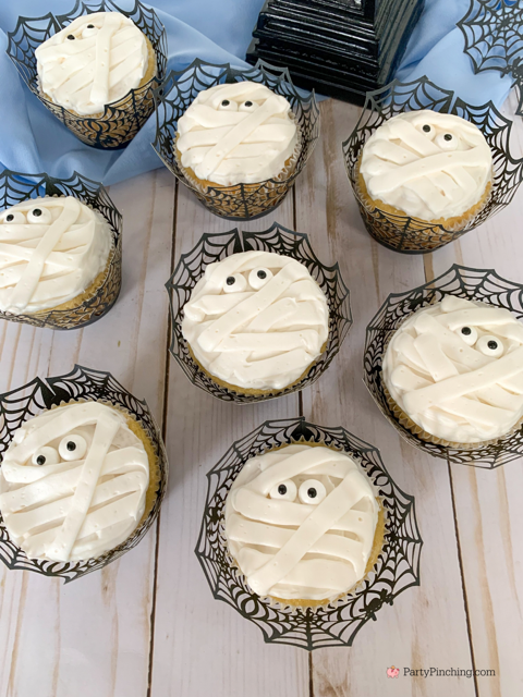 a baby is brewing baby shower Halloween theme for baby boy, cute Halloween baby shower ghost cookies, cute onesie cookies for baby shower, cute mummy cupcake cauldron brownies, cute bat cookies, cute ghost meringue cookies, spider oreos