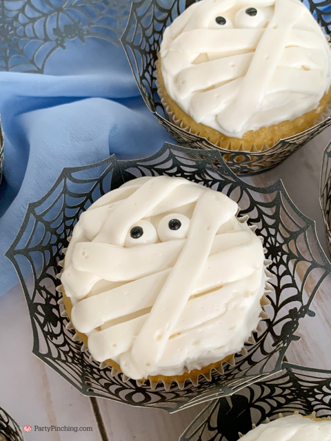 a baby is brewing baby shower Halloween theme for baby boy, cute Halloween baby shower ghost cookies, cute onesie cookies for baby shower, cute mummy cupcake cauldron brownies, cute bat cookies, cute ghost meringue cookies, spider oreos
