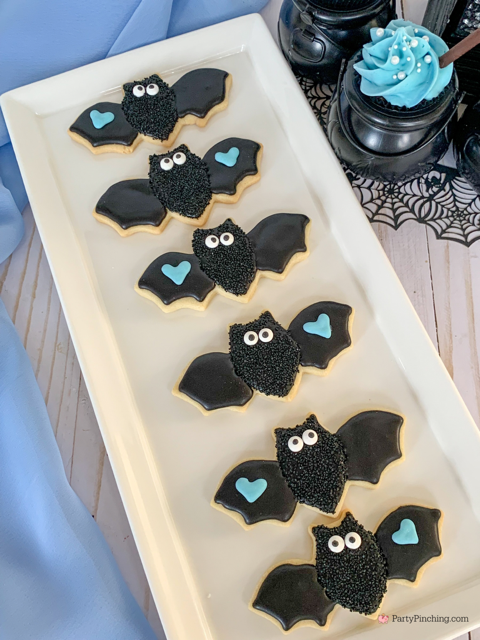 a baby is brewing baby shower Halloween theme for baby boy, cute Halloween baby shower ghost cookies, cute onesie cookies for baby shower, cute mummy cupcake cauldron brownies, cute bat cookies, cute ghost meringue cookies, spider oreos
