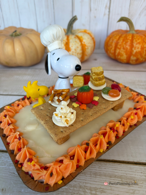 Snoopy's Thanksgiving Dinner Cake, Snoopy's Thanksgiving Feast, Snoopy Trader Joe's Mini Cake, Trader Joe's Mini Thanksgiving Cake, A Charlie Brown Thanksgiving, Snoopy, Charlie Brown, Woodstock, Jelly beans popcorn pretzels toast Thanksgiving dinner, easy no bake Thanksgiving dessert, Thanksgiving ideas for kids, best easy Thanksgiving recipes