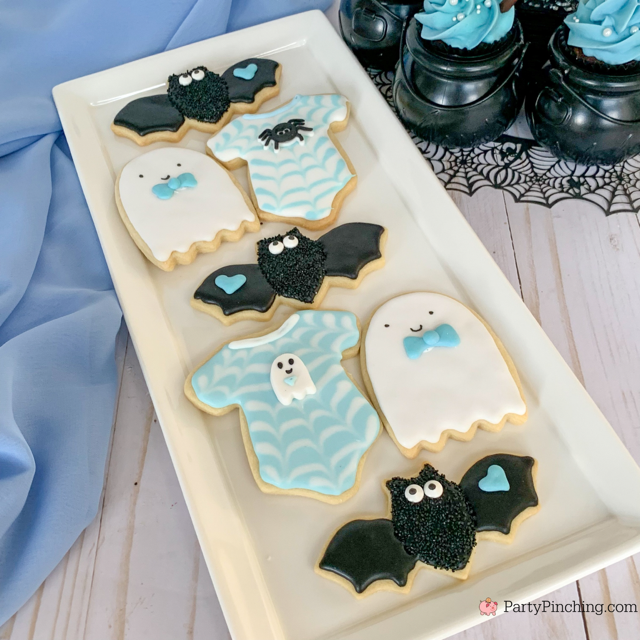 a baby is brewing baby shower Halloween theme for baby boy, cute Halloween baby shower ghost cookies, cute onesie cookies for baby shower, cute mummy cupcake cauldron brownies, cute bat cookies, cute ghost meringue cookies, spider oreos